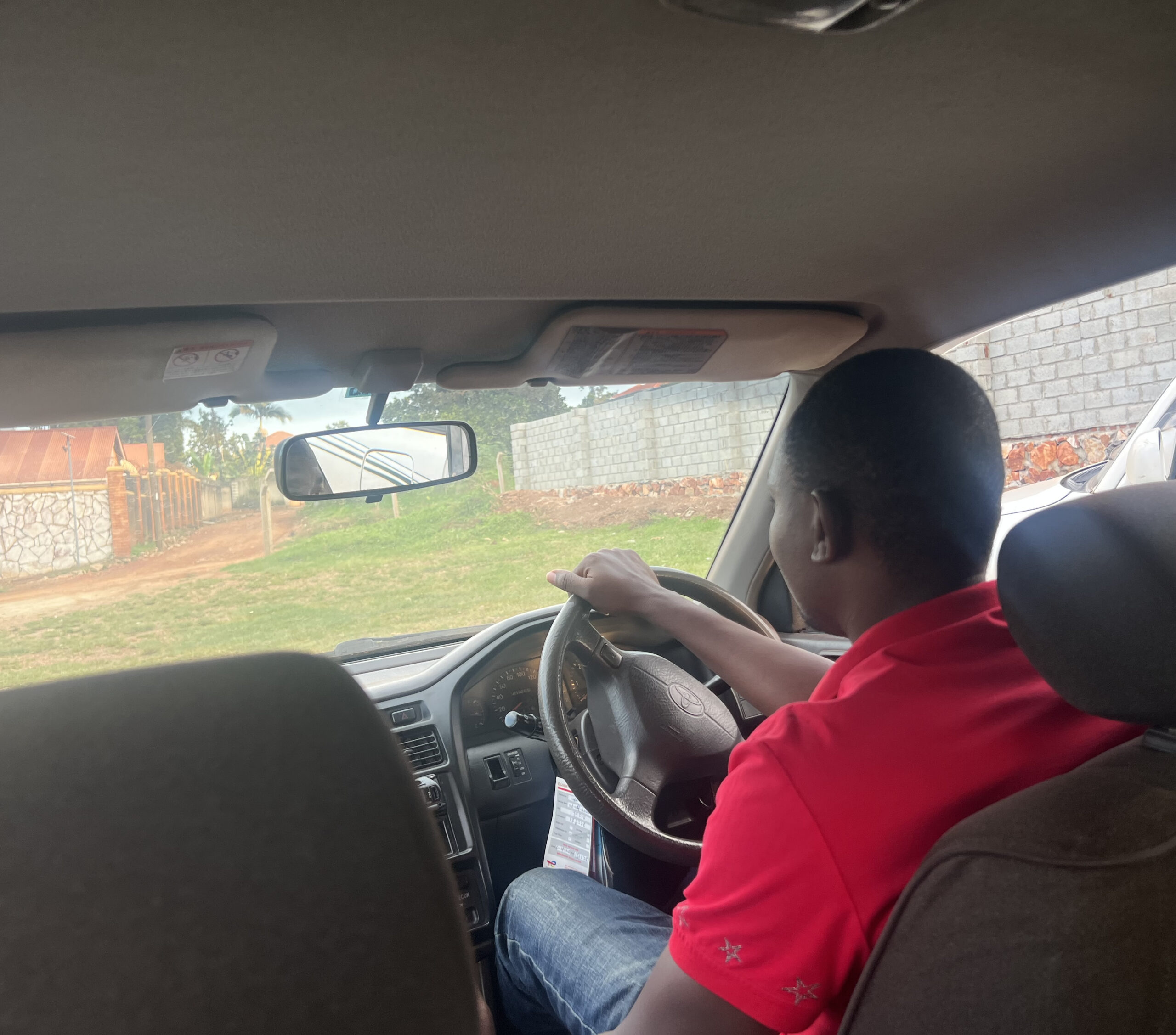Car Rent With a Driver in Uganda - A driver during an NGO fieldwork Visit in Kamuli, Uganda